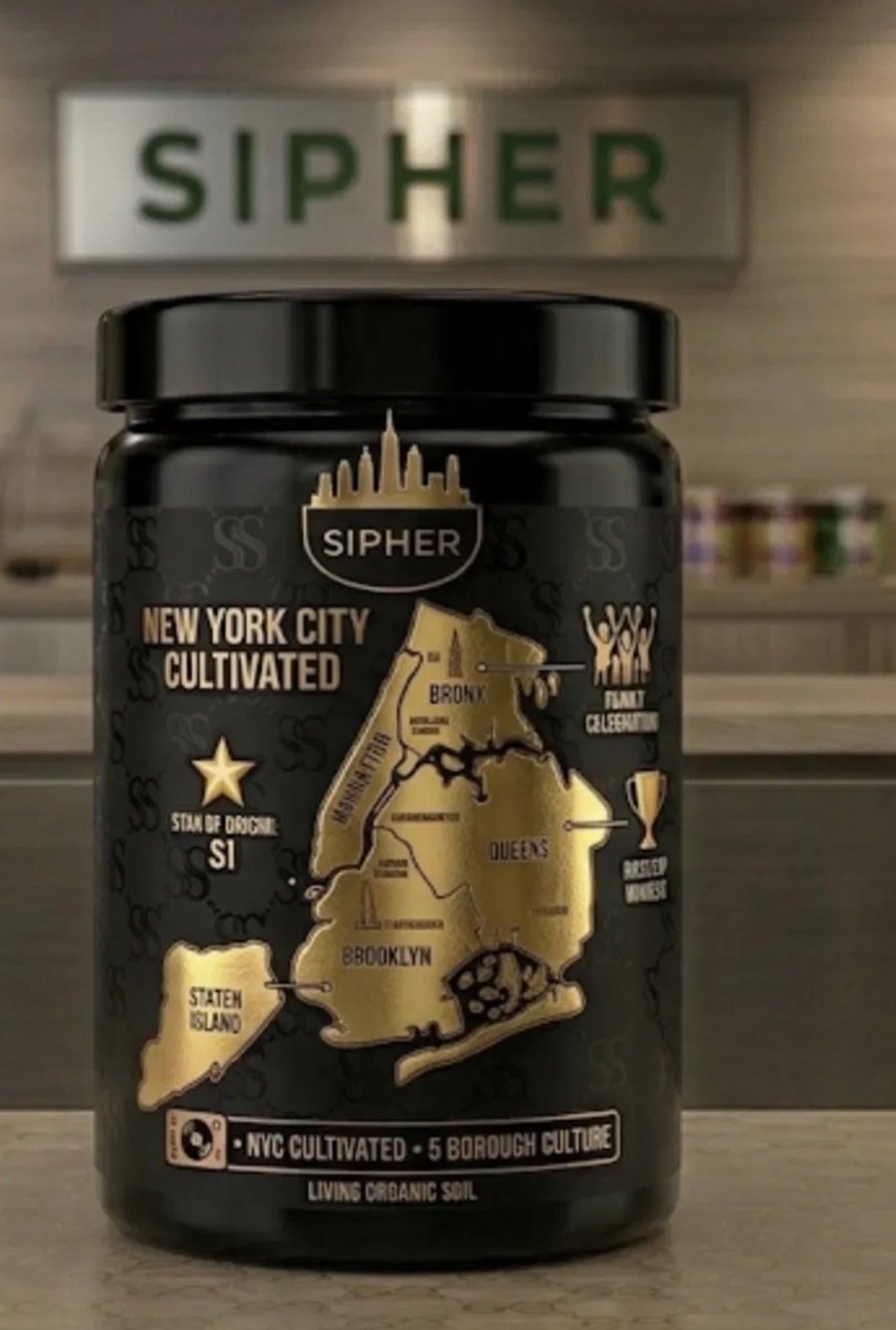 The Sipher jar: black with a gold map of the five boroughs and Staten Island starred as the origin