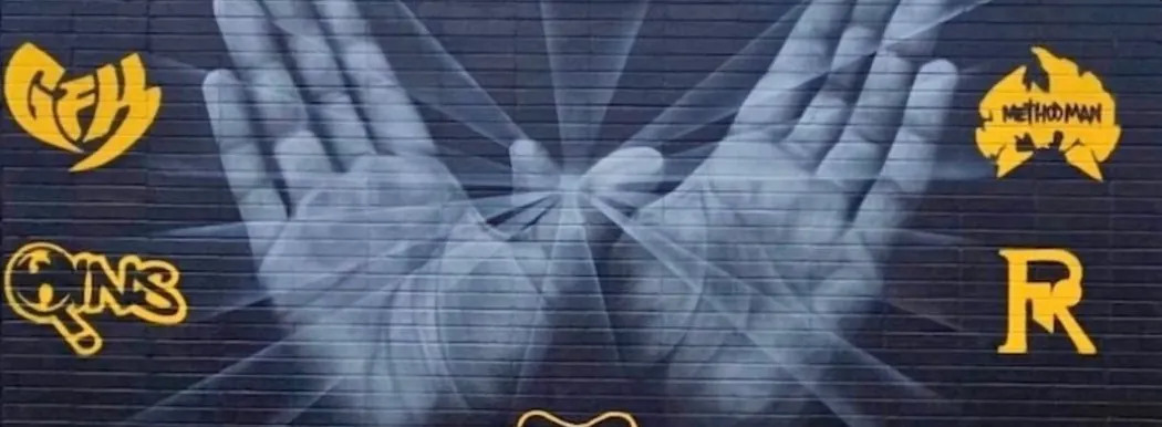 Staten Island mural of two open hands surrounded by gold borough logos